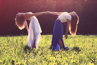 women holding hands and leaning backwards women holding hands and leaning backwards