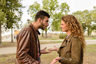 couple arguing in park