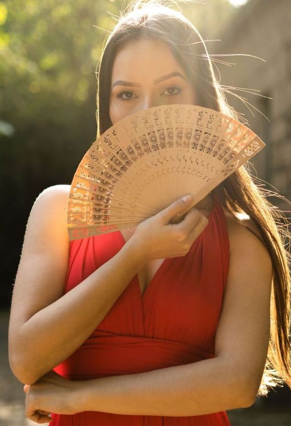 woman-covering-her-face-with-a-fan-2910551-min woman covering her face with a fan