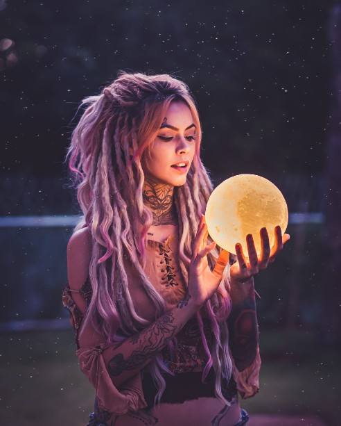 pexels-wellington-cunha-2479882 woman with crystal ball who knows how to manifest love