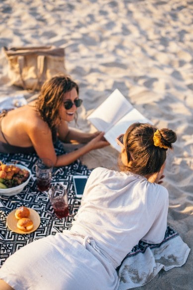 pexels-anna-tarazevich-8151608-min friends hanging out at the beach
