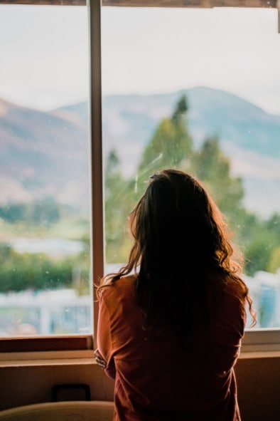 pexels-felipe-cespedes-3029699-min woman staring out the window and wondering, "Why do I get attached so easily?"